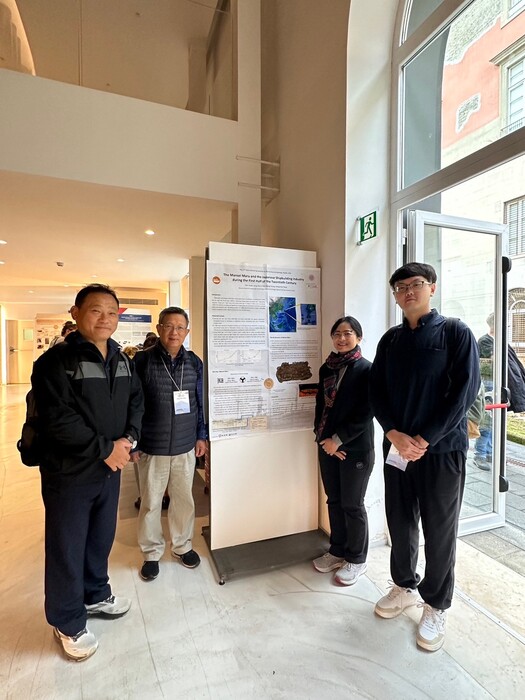 Group photo with team members and the poster.